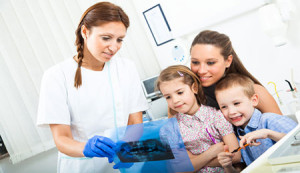 Pediatric dental assistant showing xray