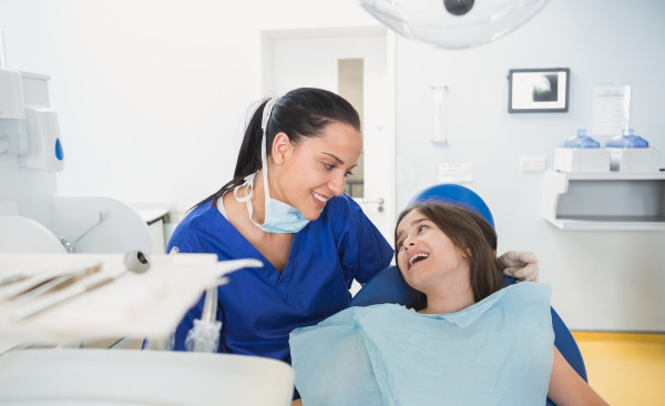 Pediatric Dental Assistant School student with kid