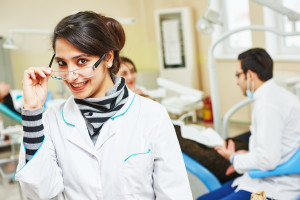 Smiling pediatric dental assistant