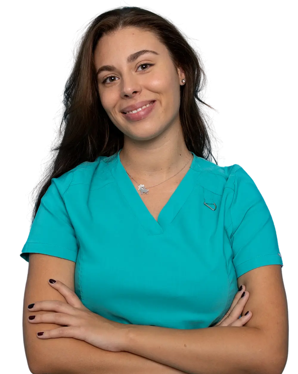 smiling pediatric dental assistant with arms crossed in green scrubs